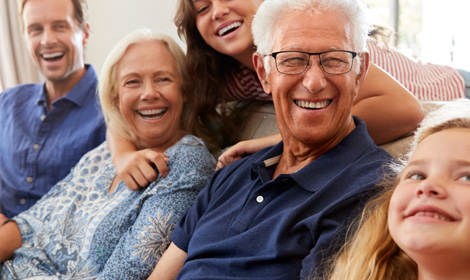 happy family gathered together in the living room of their home
