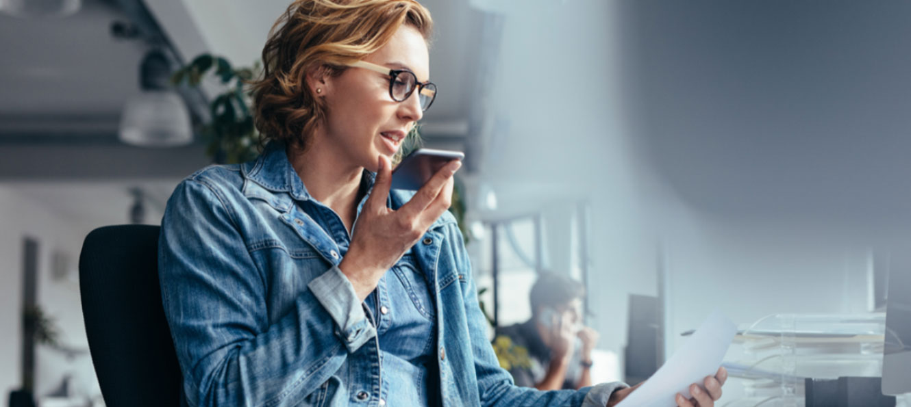 woman in a casual office environment talking on a cell phone