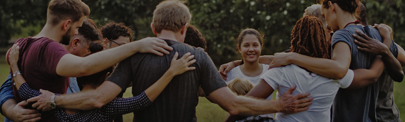 group of people gathered together in a circle