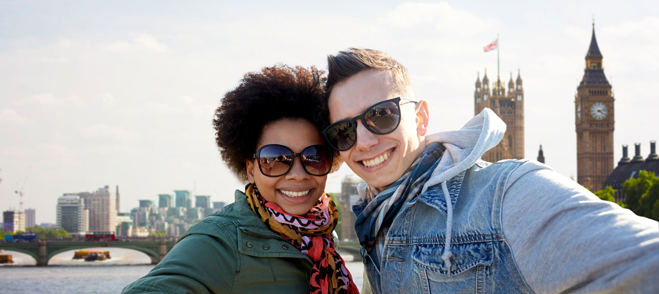 couple traveling internationally and taking a selfie photo