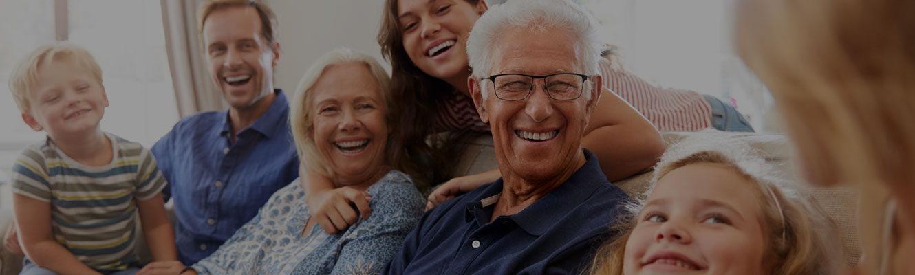 portrait of an extended family smiling together